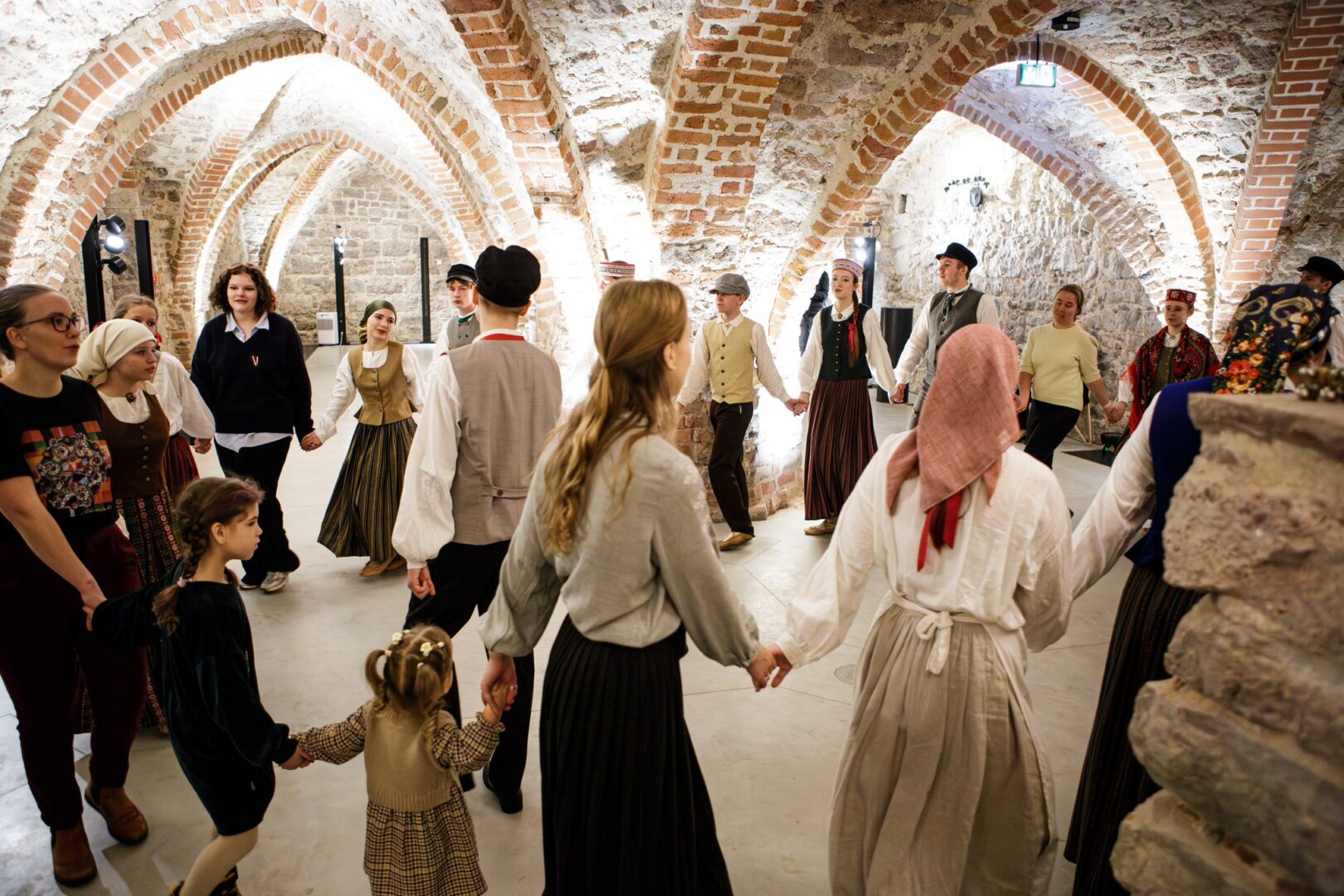 People dancing in Riga Castle cellars.